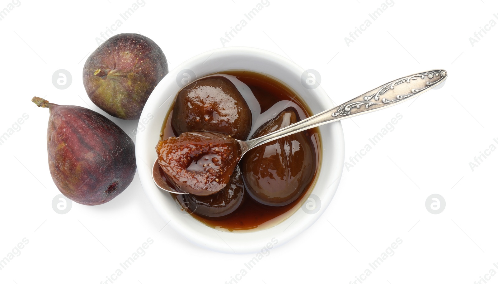 Photo of Bowl of tasty sweet jam and fresh figs isolated on white, top view
