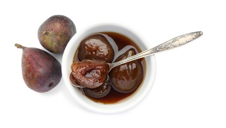 Bowl of tasty sweet jam and fresh figs isolated on white, top view