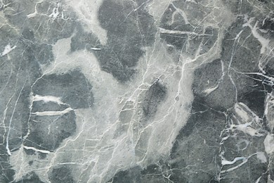 Texture of grey marble stone surface as background, closeup