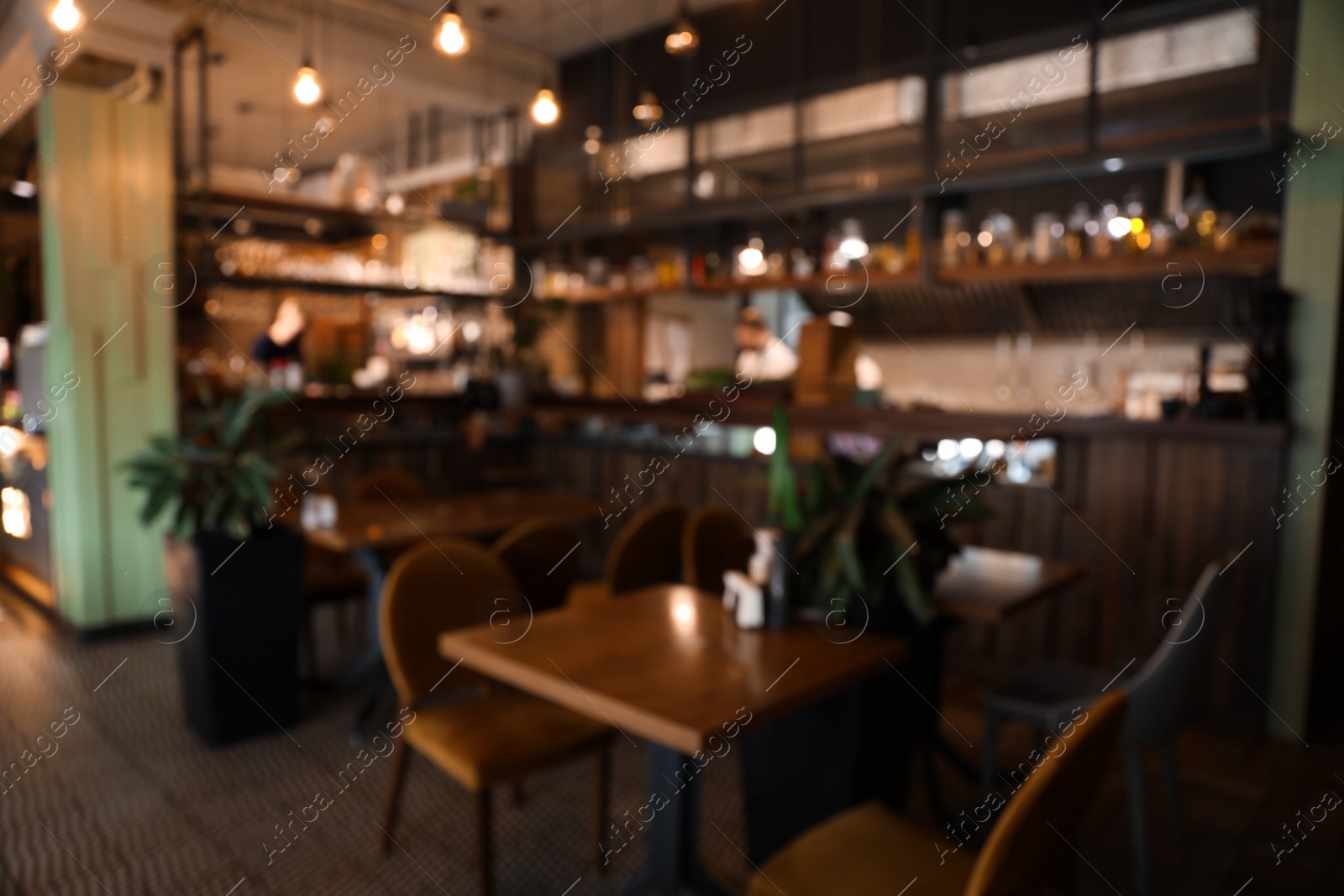 Photo of Blurred view of stylish modern cafe interior with bokeh effect