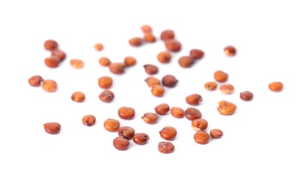 Raw red quinoa seeds on white background