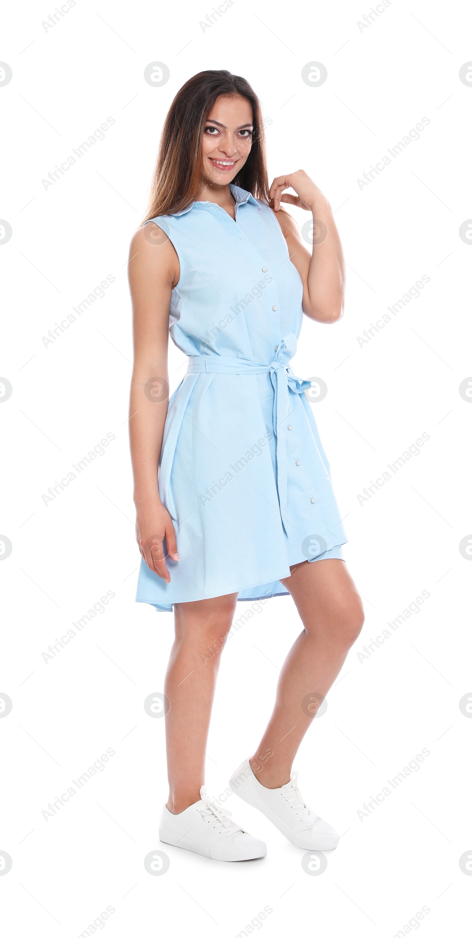 Photo of Full length portrait of beautiful young woman in dress on white background