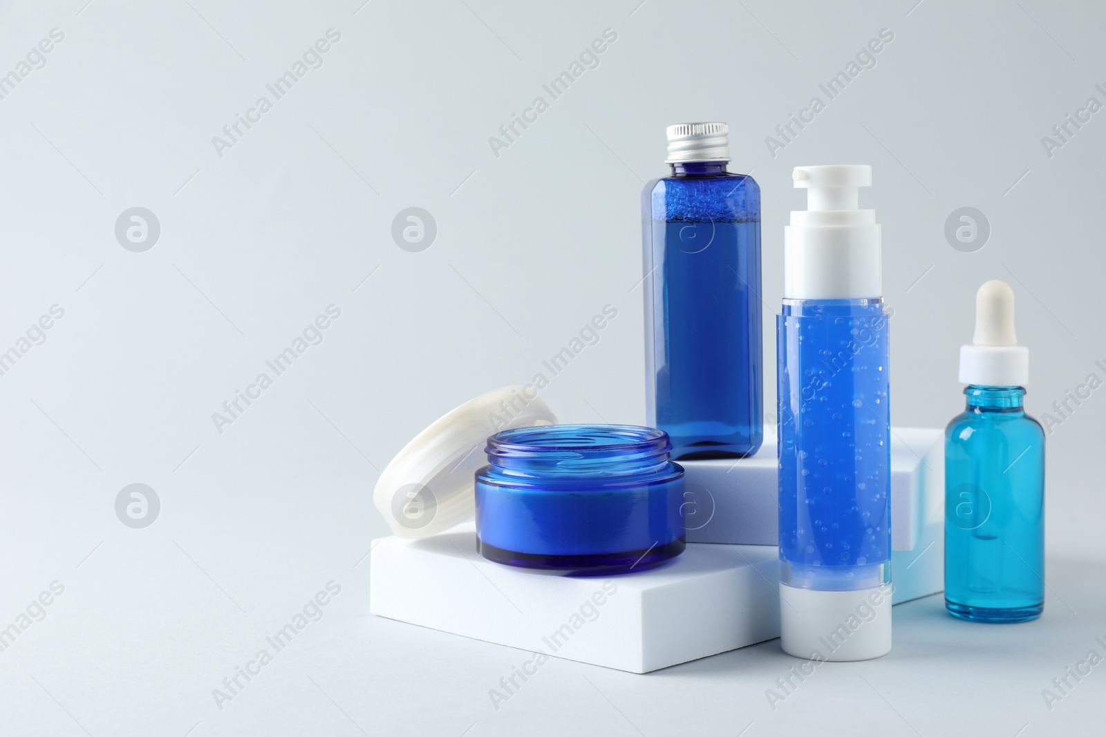 Photo of Set of luxury cosmetic products on white background. Space for text