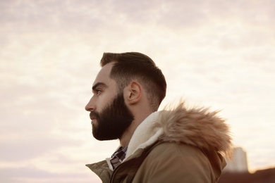 Portrait of stylish handsome young man outdoors