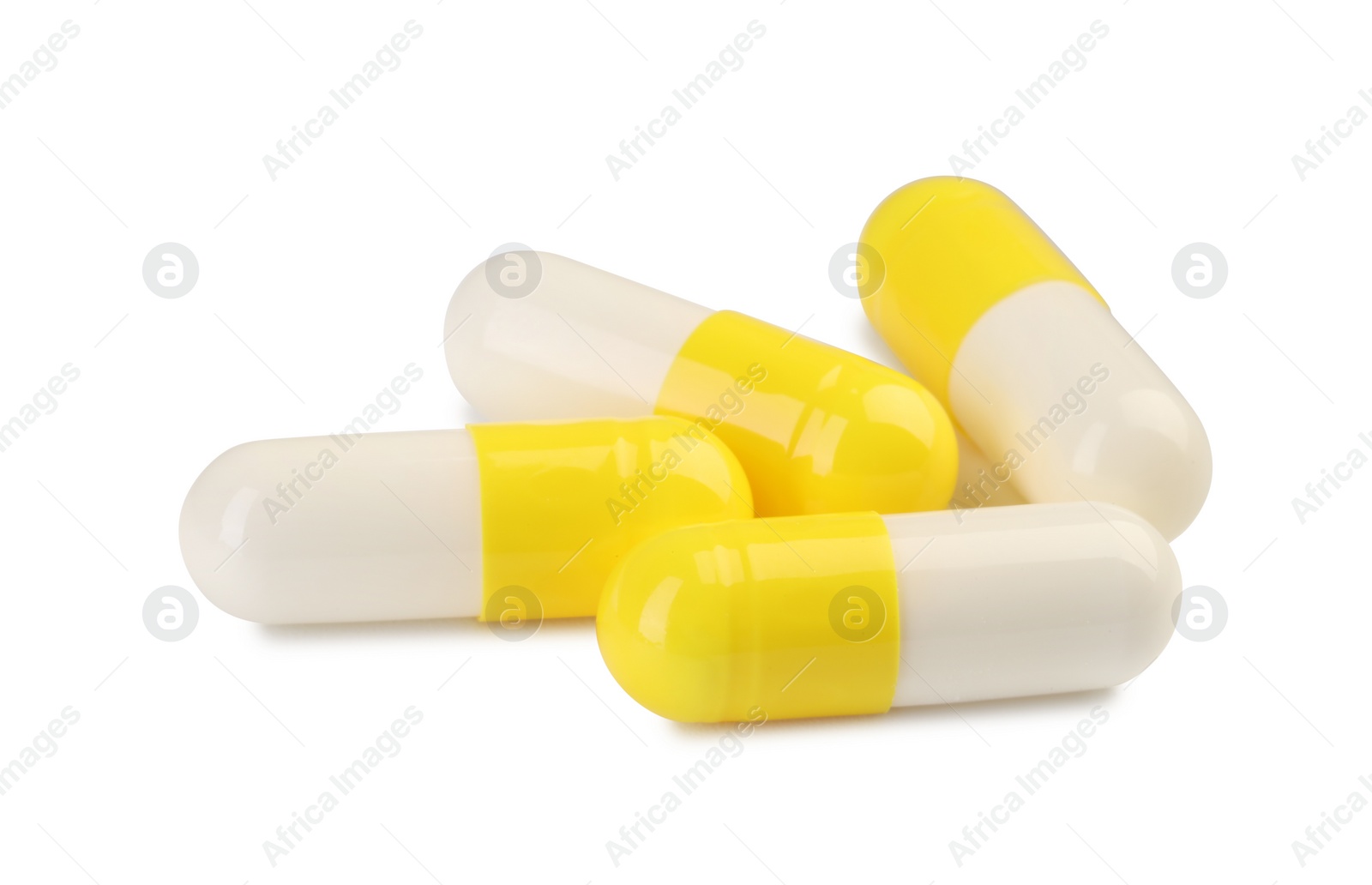 Photo of Many antibiotic pills isolated on white. Medicinal treatment