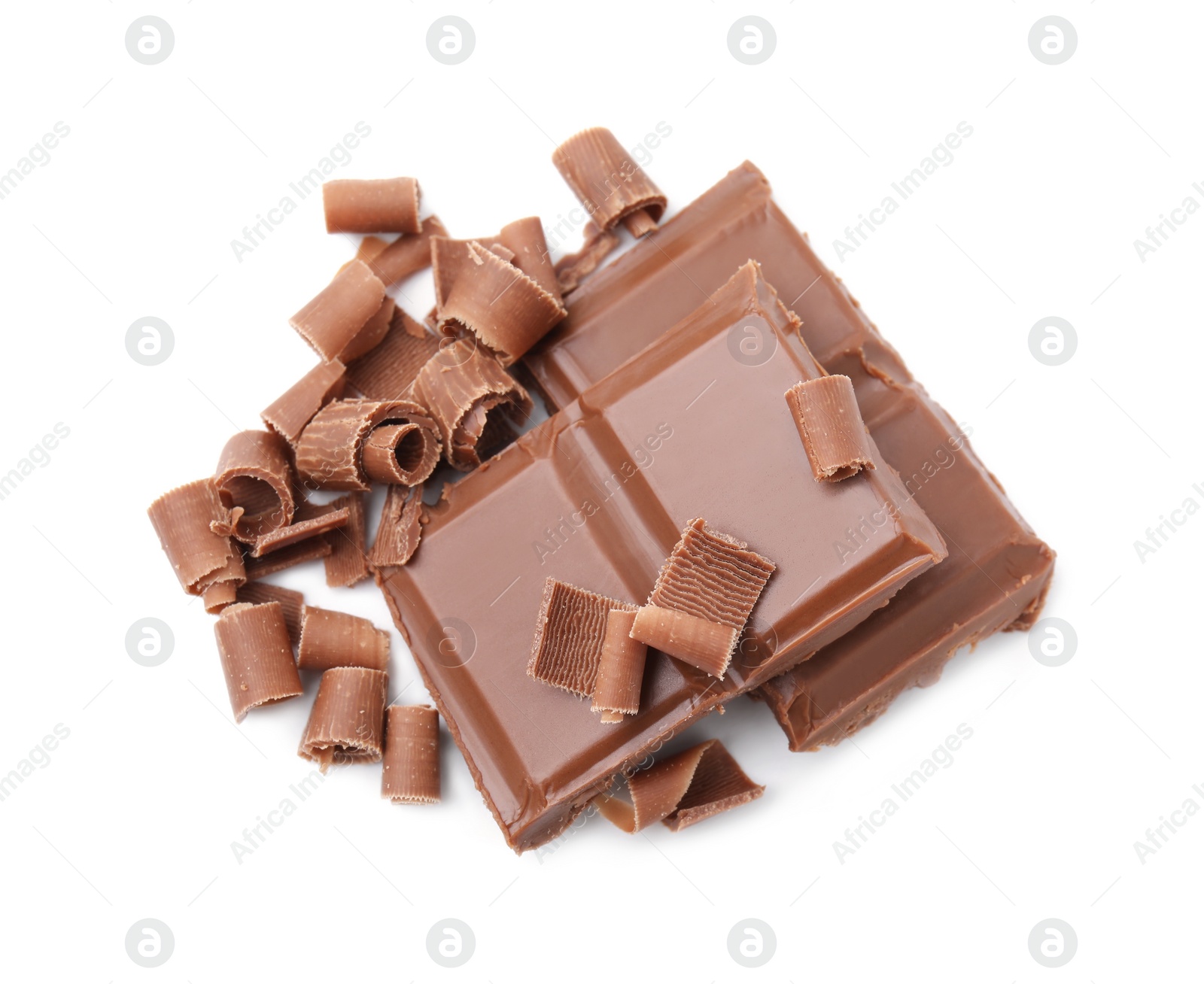 Photo of Pieces of tasty chocolate bar and shavings isolated on white, above view