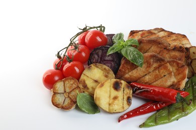 Photo of Tasty grilled vegetables, meat, fresh cherry tomatoes and basil isolated on white