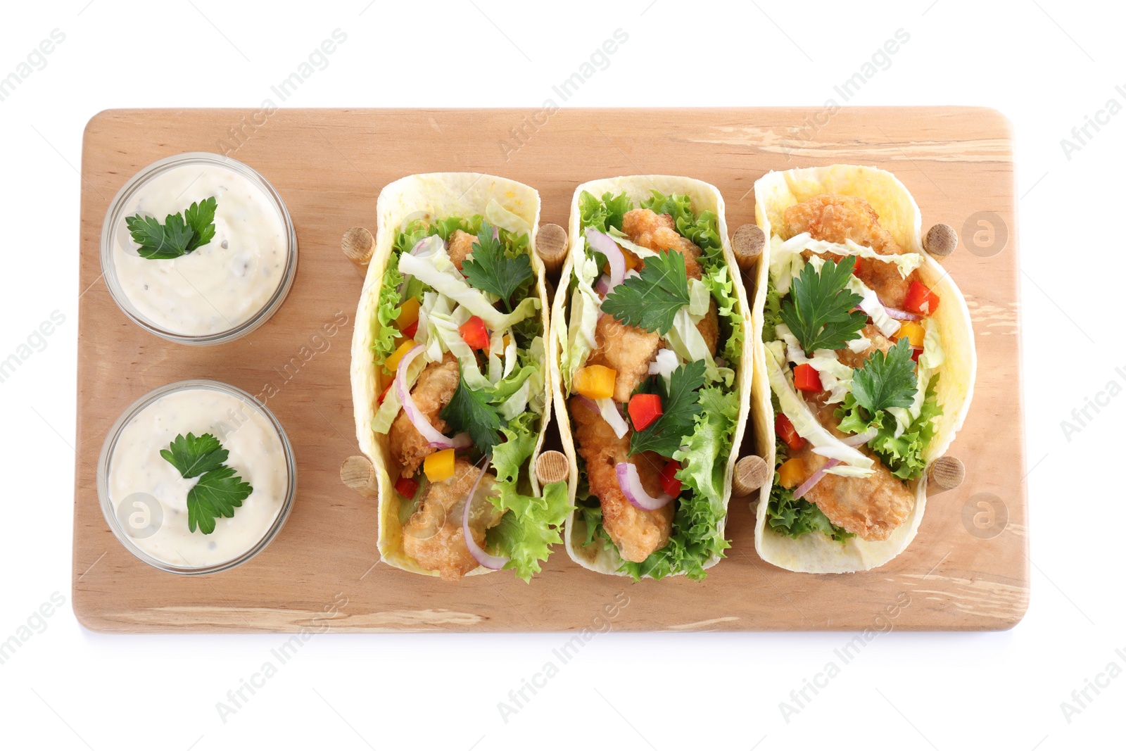 Photo of Yummy fish tacos with sauce isolated on white, top view