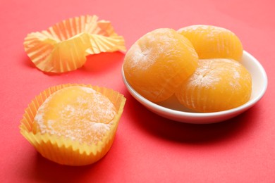 Photo of Delicious mochi on red background. Traditional Japanese dessert