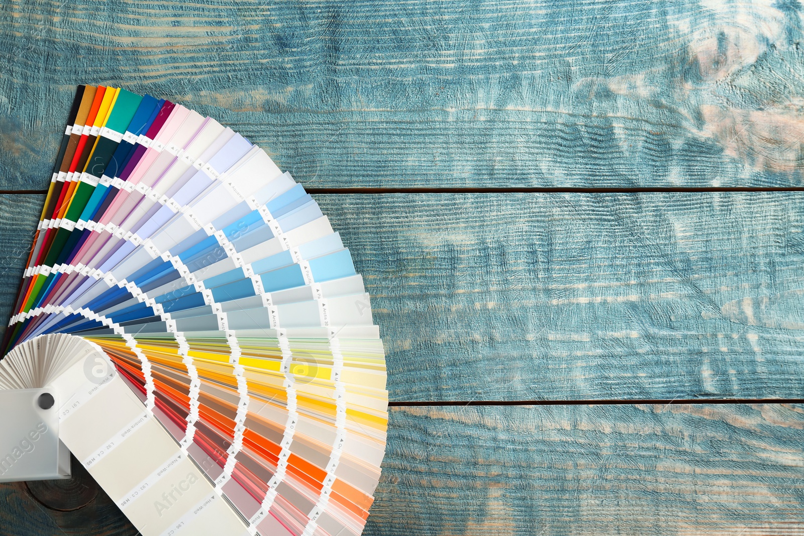 Photo of Color palette samples on wooden background