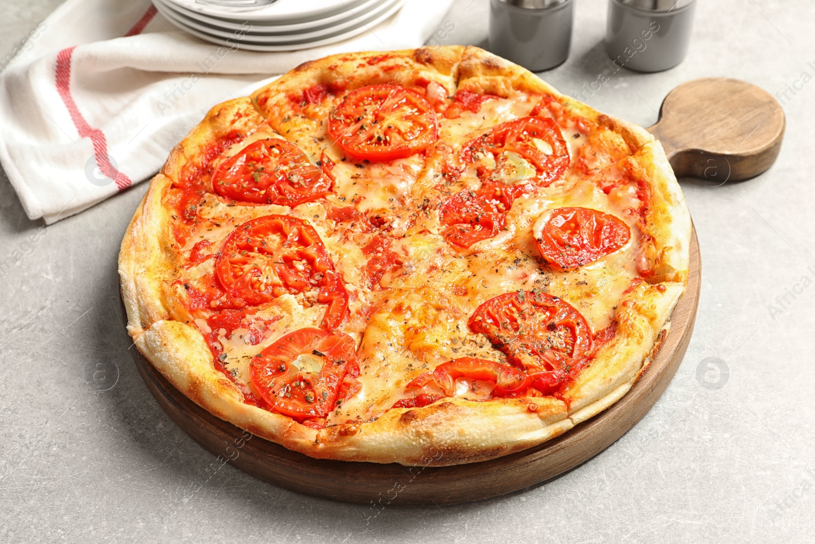 Photo of Hot cheese pizza Margherita on grey table