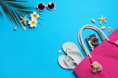 Flat lay composition with beach accessories on color background, space for text