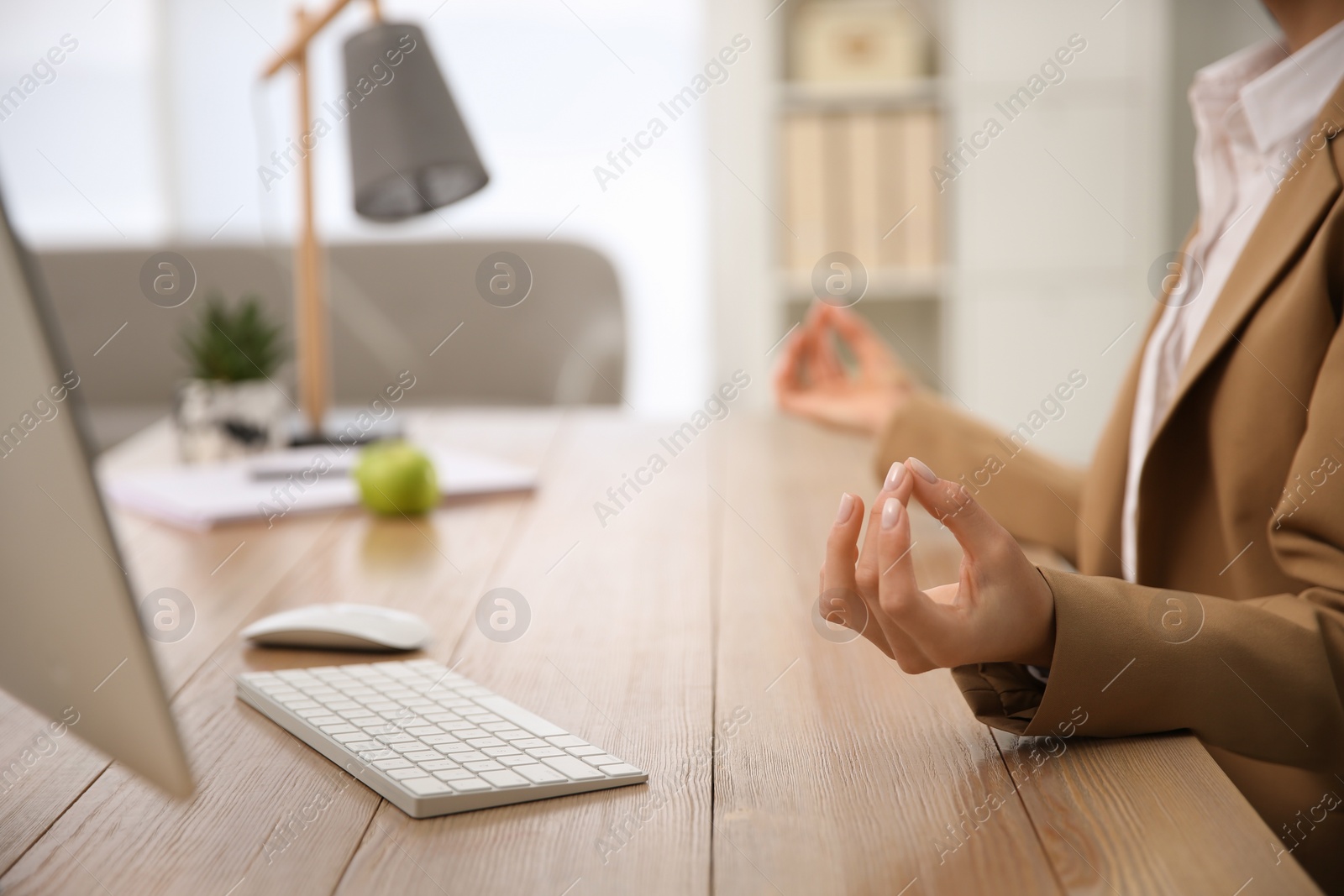 Photo of Woman meditating at workplace in office, closeup. Space for text