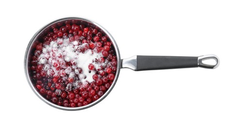 Photo of Making cranberry sauce. Fresh cranberries with sugar in saucepan isolated on white, top view