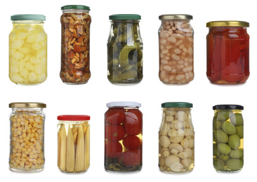 Image of Set of different jars with pickled vegetables and mushrooms on white background 