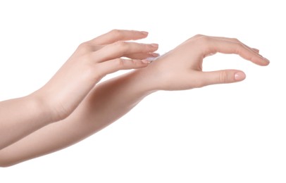 Photo of Woman applying cream on her hand against white background, closeup