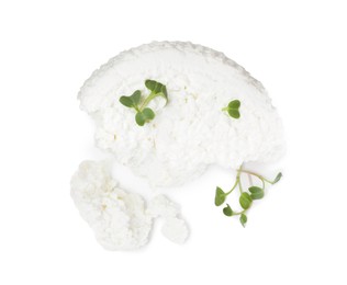 Photo of Fresh cottage cheese with microgreens isolated on white, top view