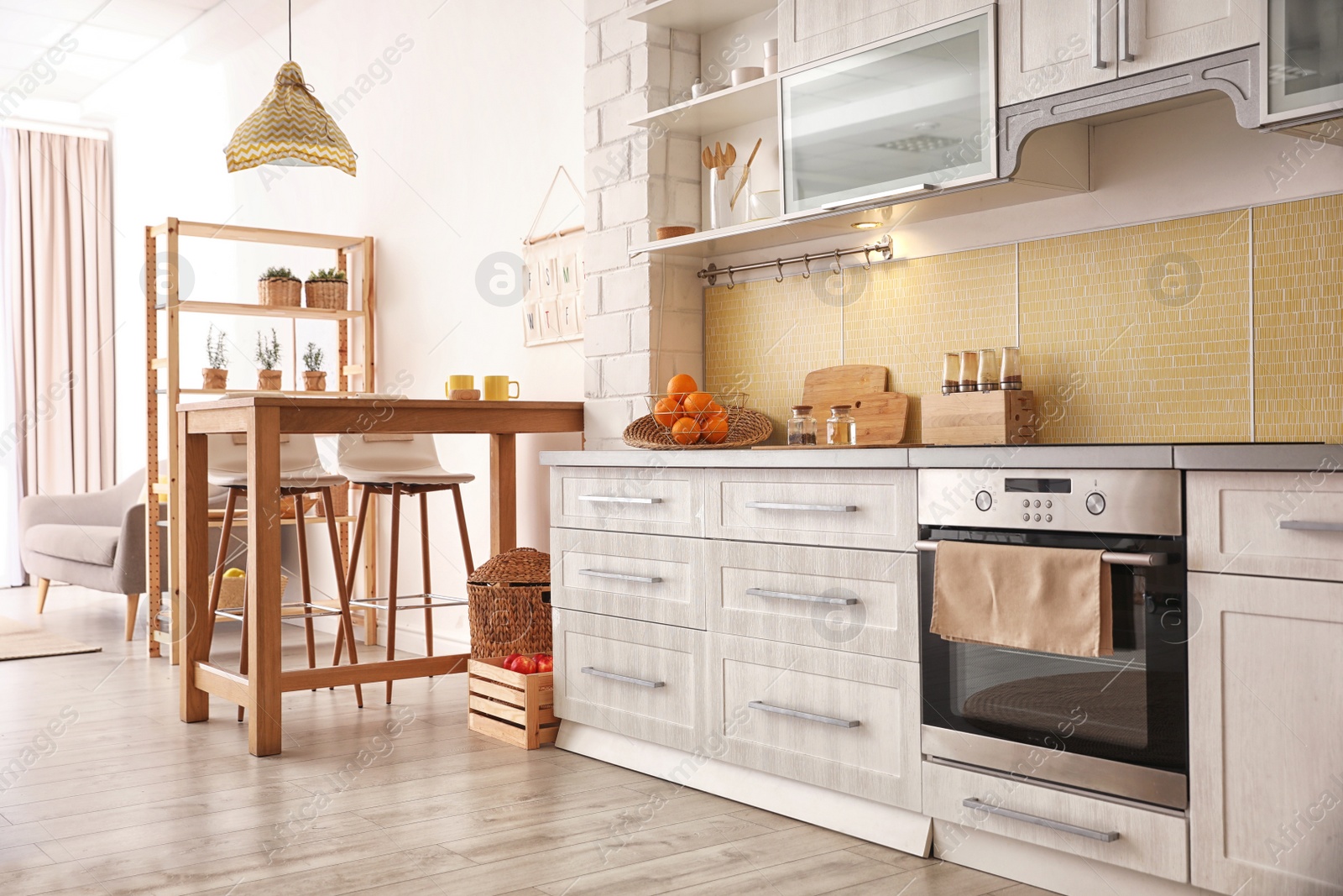 Photo of Modern kitchen interior with stylish wooden table