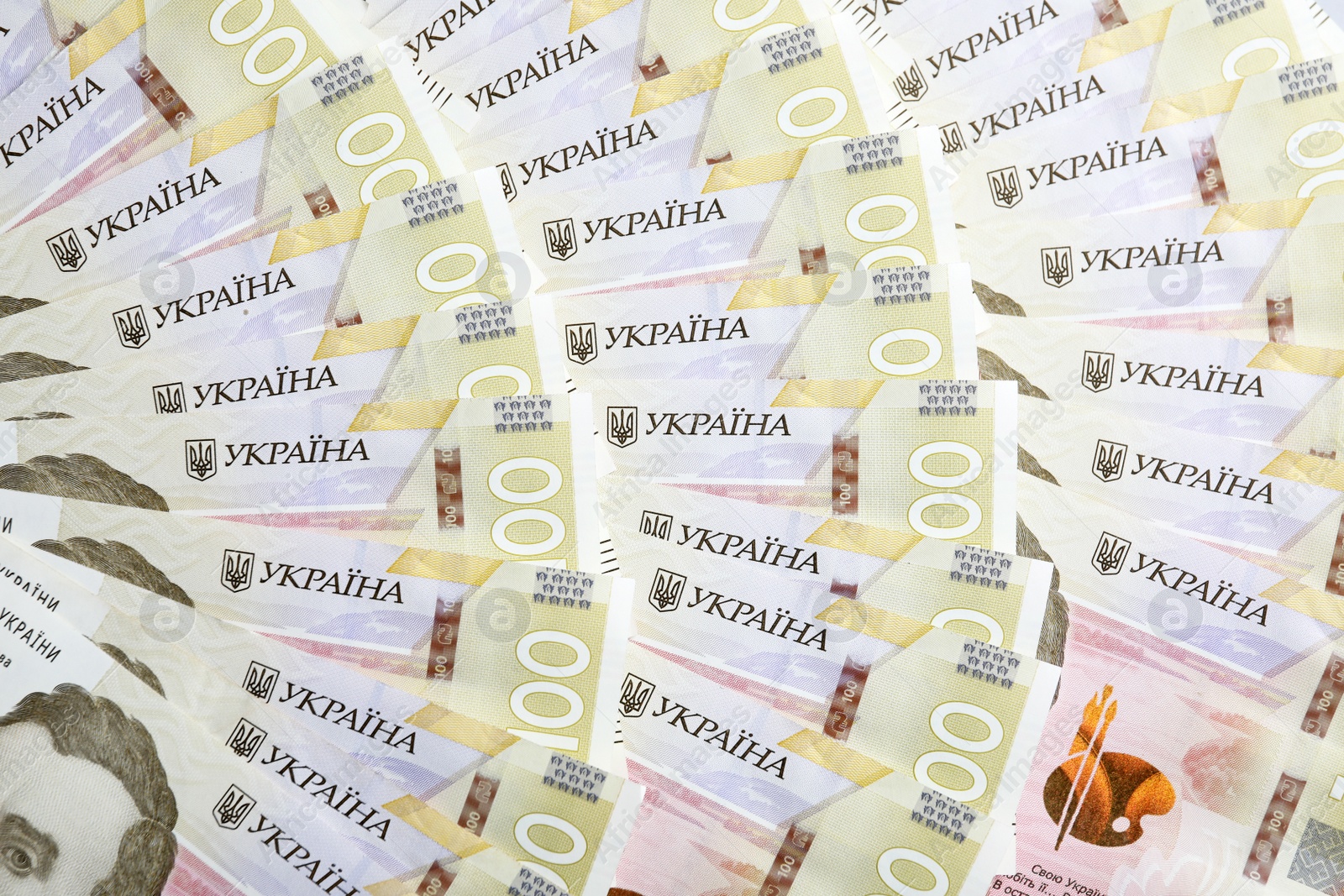 Photo of Closeup view of Ukrainian money as background. National currency