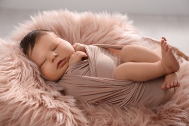 Photo of Cute newborn baby sleeping on fuzzy blanket, closeup