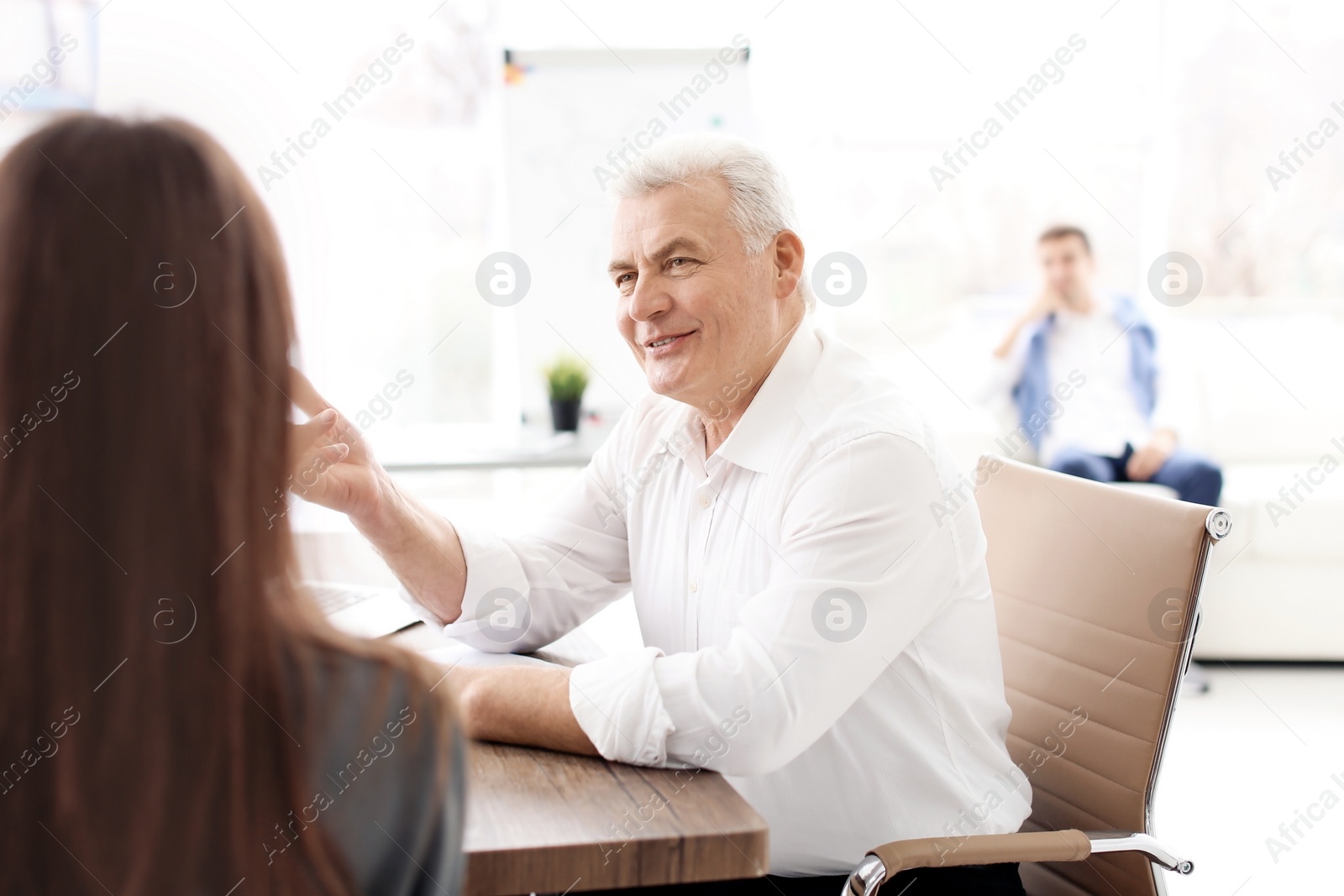 Photo of Human resources manager conducting job interview with applicant in office