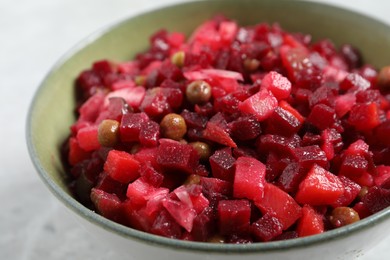 Delicious fresh vinaigrette salad in bowl, closeup