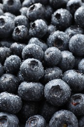 Photo of Wet fresh blueberries as background, closeup view