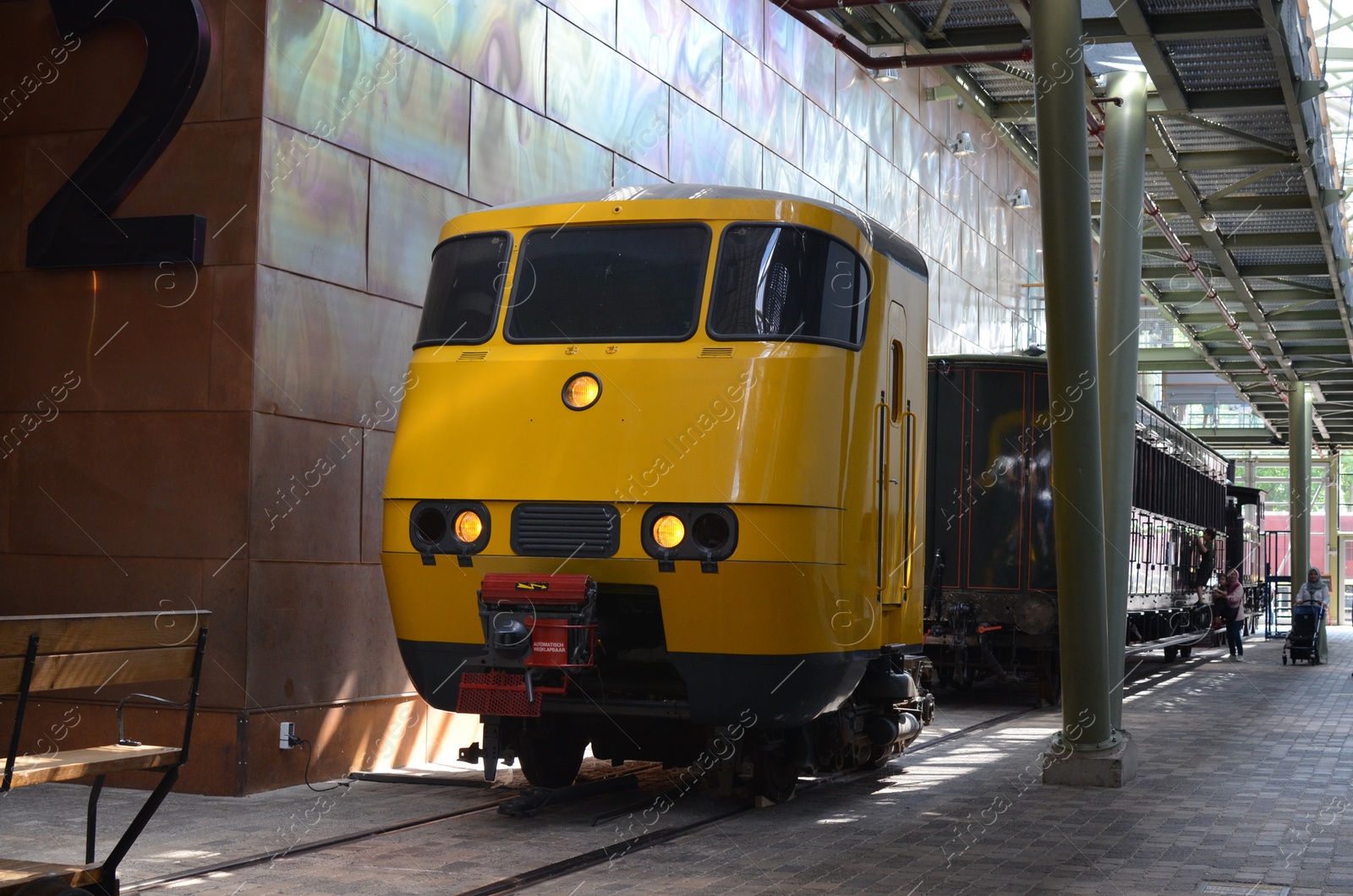 Photo of Utrecht, Netherlands - July 23, 2022: Old yellow train on display in Spoorwegmuseum