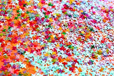 Photo of Shiny bright colorful glitter as background, closeup
