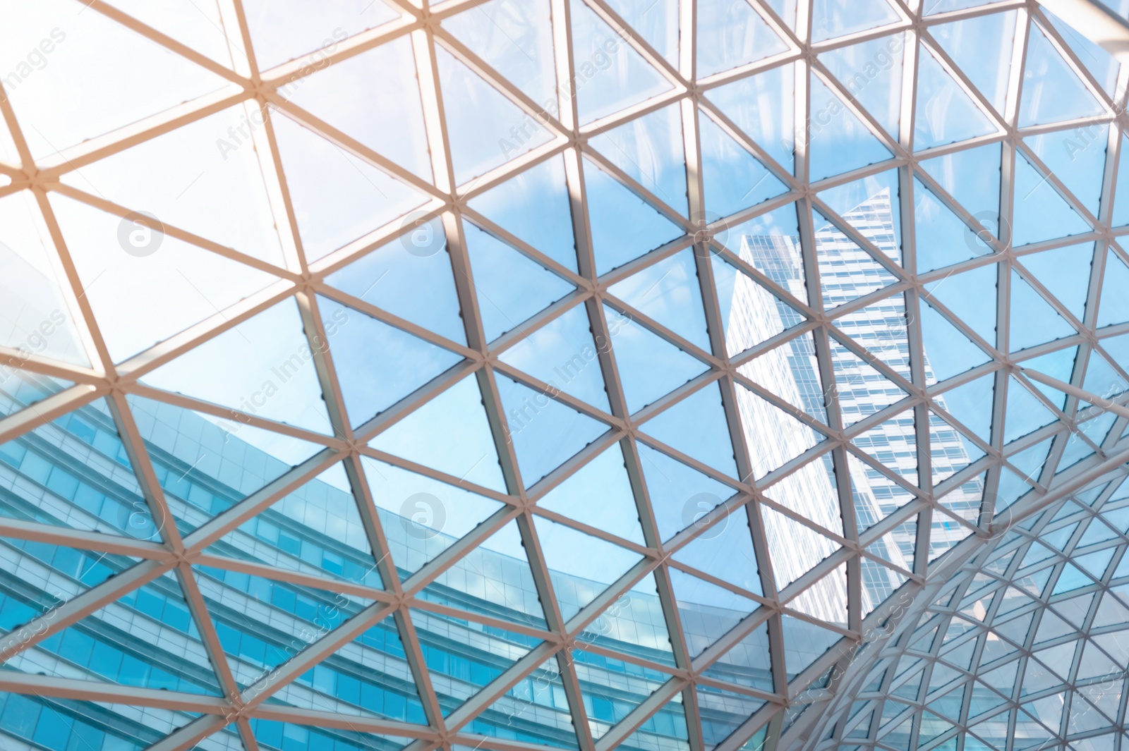 Photo of Low angle view of glass ceiling as background