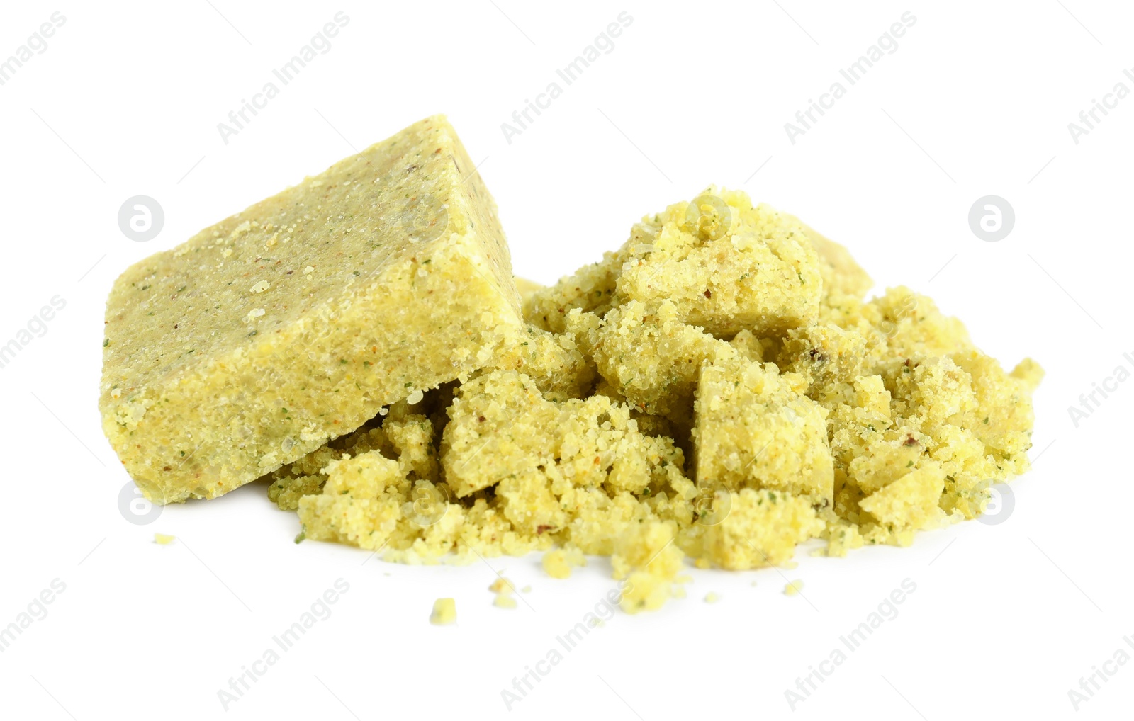 Photo of Aromatic crumbled and whole bouillon cubes on white background