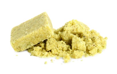 Aromatic crumbled and whole bouillon cubes on white background