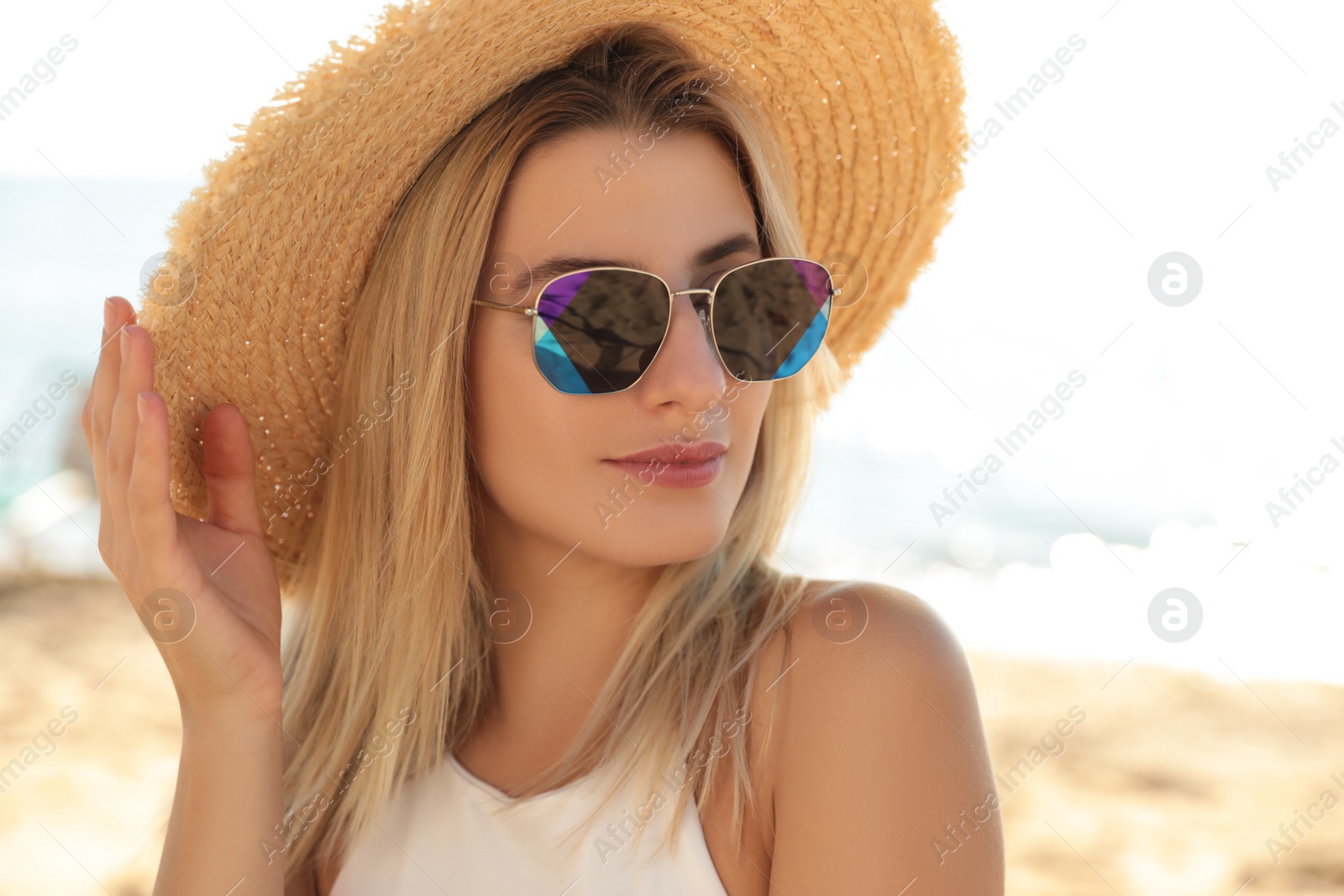 Photo of Beautiful woman wearing sunglasses outdoors on sunny day