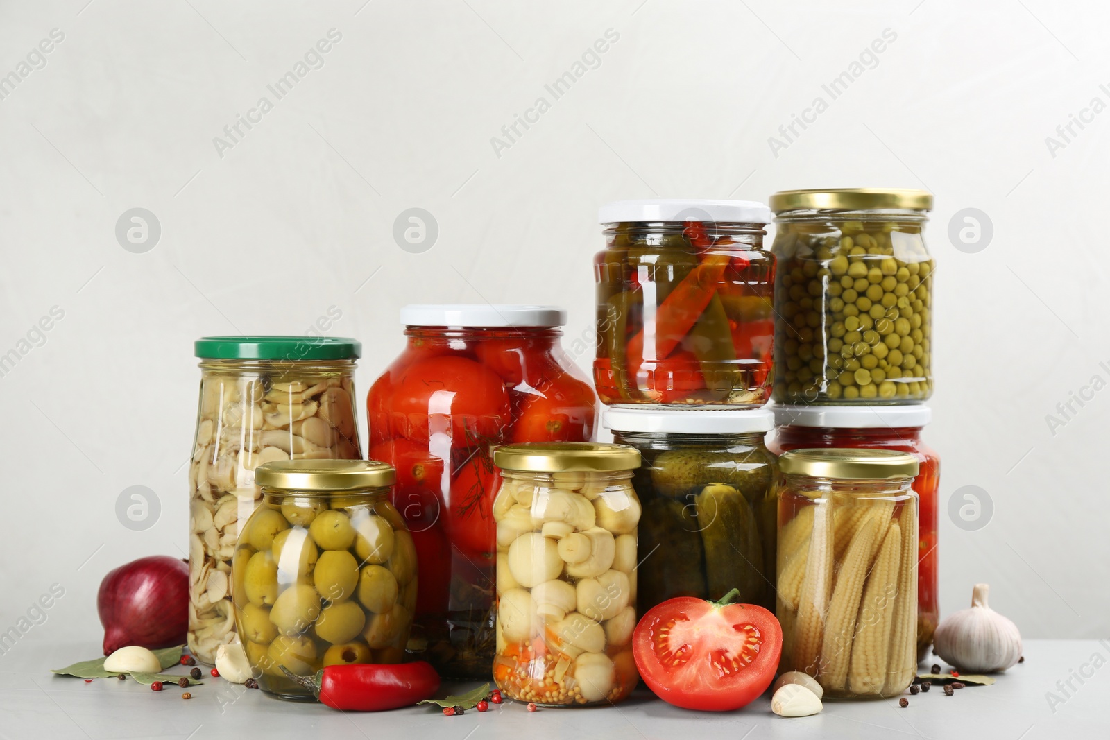 Photo of Jars of pickled vegetables on light table