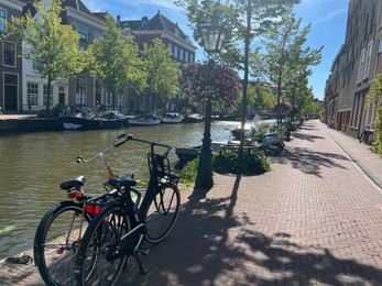 Leiden, Netherlands - August 03, 2022: View of city street with buildings along canal