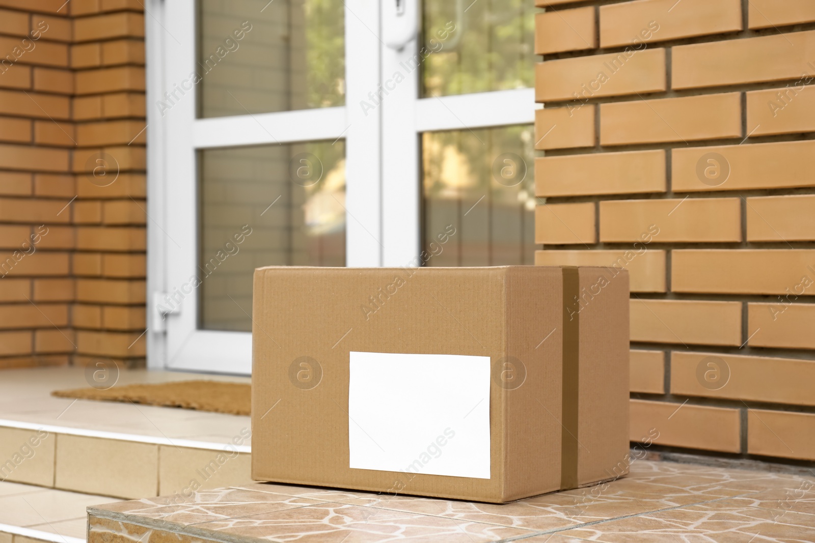 Photo of Delivered parcel on porch near front door