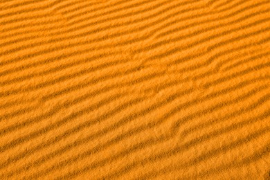 Image of Closeup view of orange sand dune in desert as background