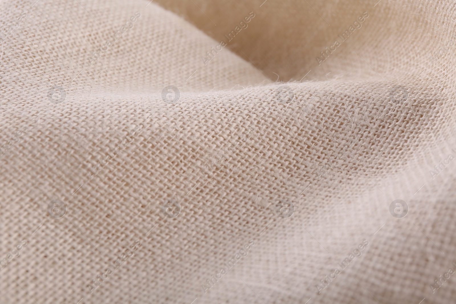 Photo of Texture of beige burlap fabric, closeup view