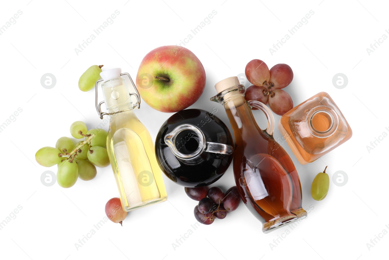 Photo of Different types of vinegar and ingredients isolated on white, top view