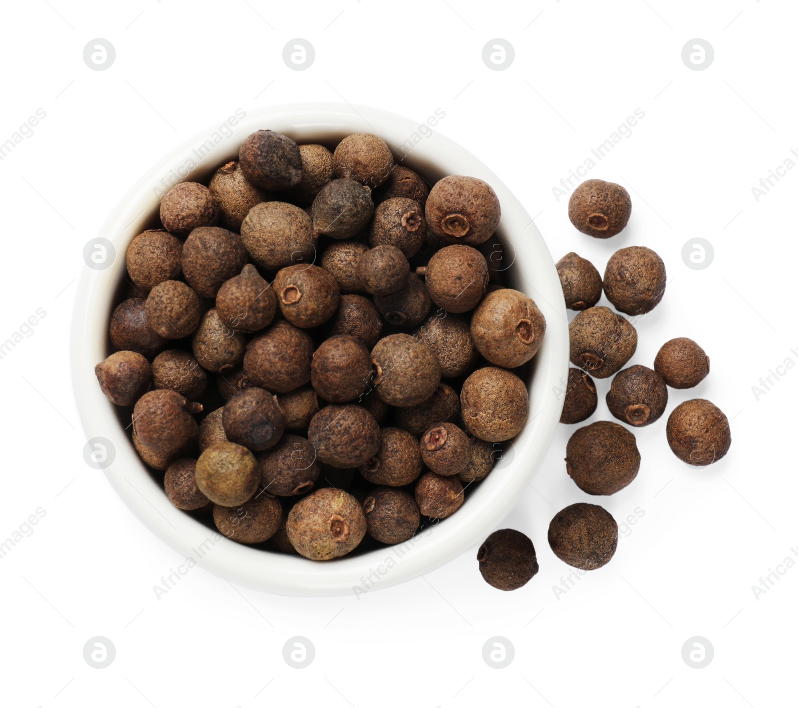 Photo of Dry allspice berries (Jamaica pepper) in bowl isolated on white, top view