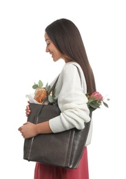 Photo of Young woman with leather shopper bag on white background