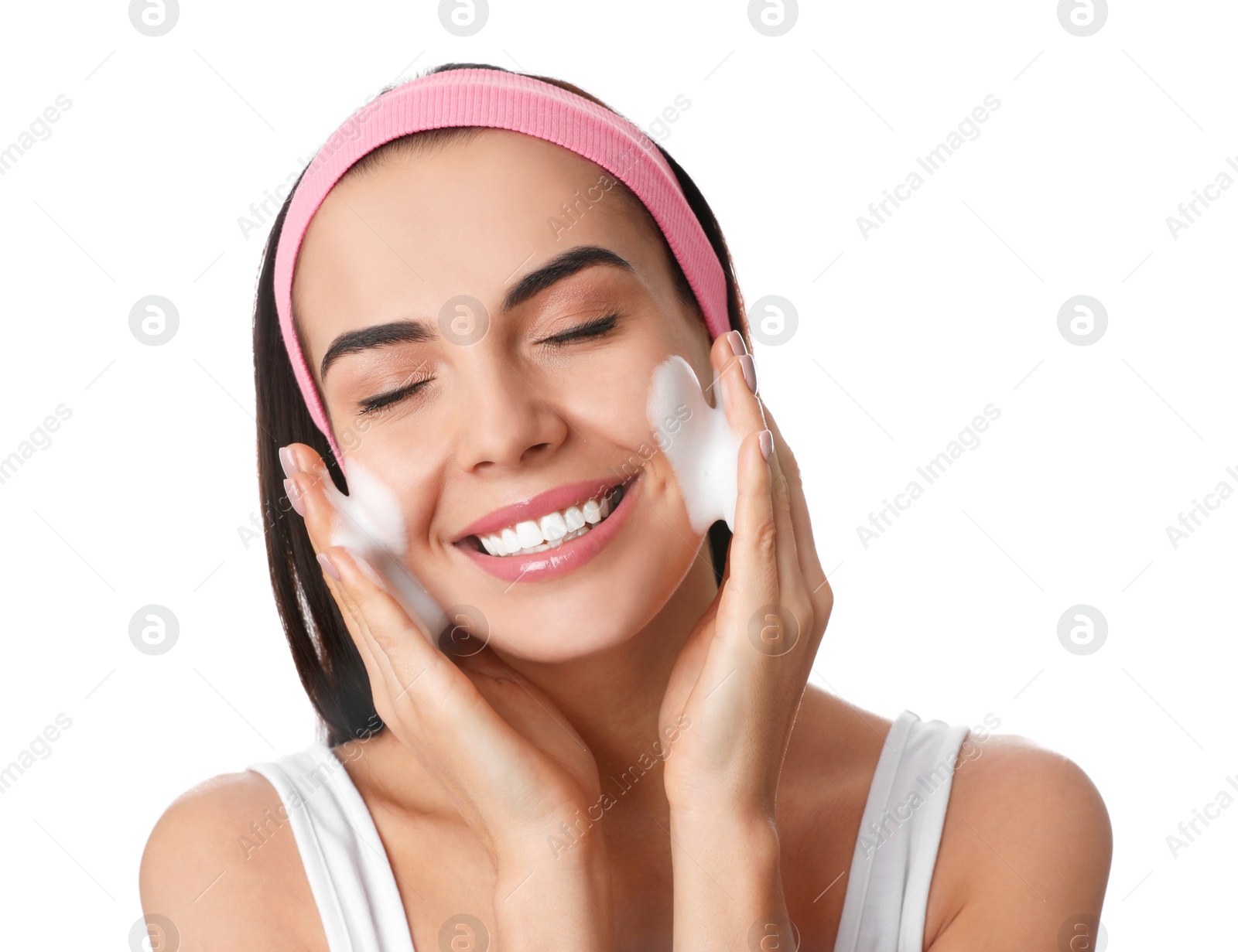 Photo of Young woman applying cosmetic product on white background. Washing routine