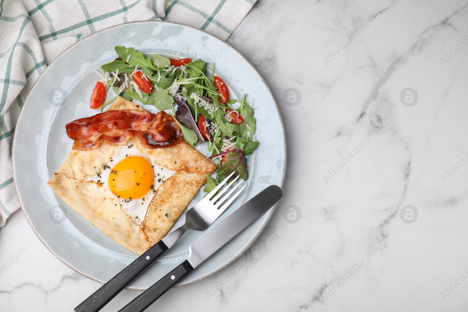 Photo of Delicious crepe with egg served on white marble table, flat lay. with space for text. Breton galette