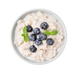 Photo of Delicious barley porridge with blueberries and mint in bowl isolated on white, top view