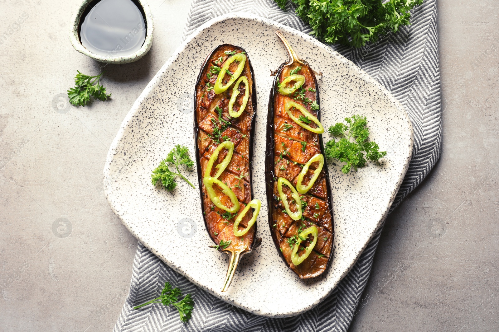 Photo of Plate with fried eggplant slices on table, top view