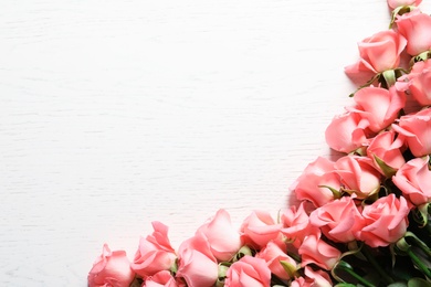 Beautiful roses on wooden table