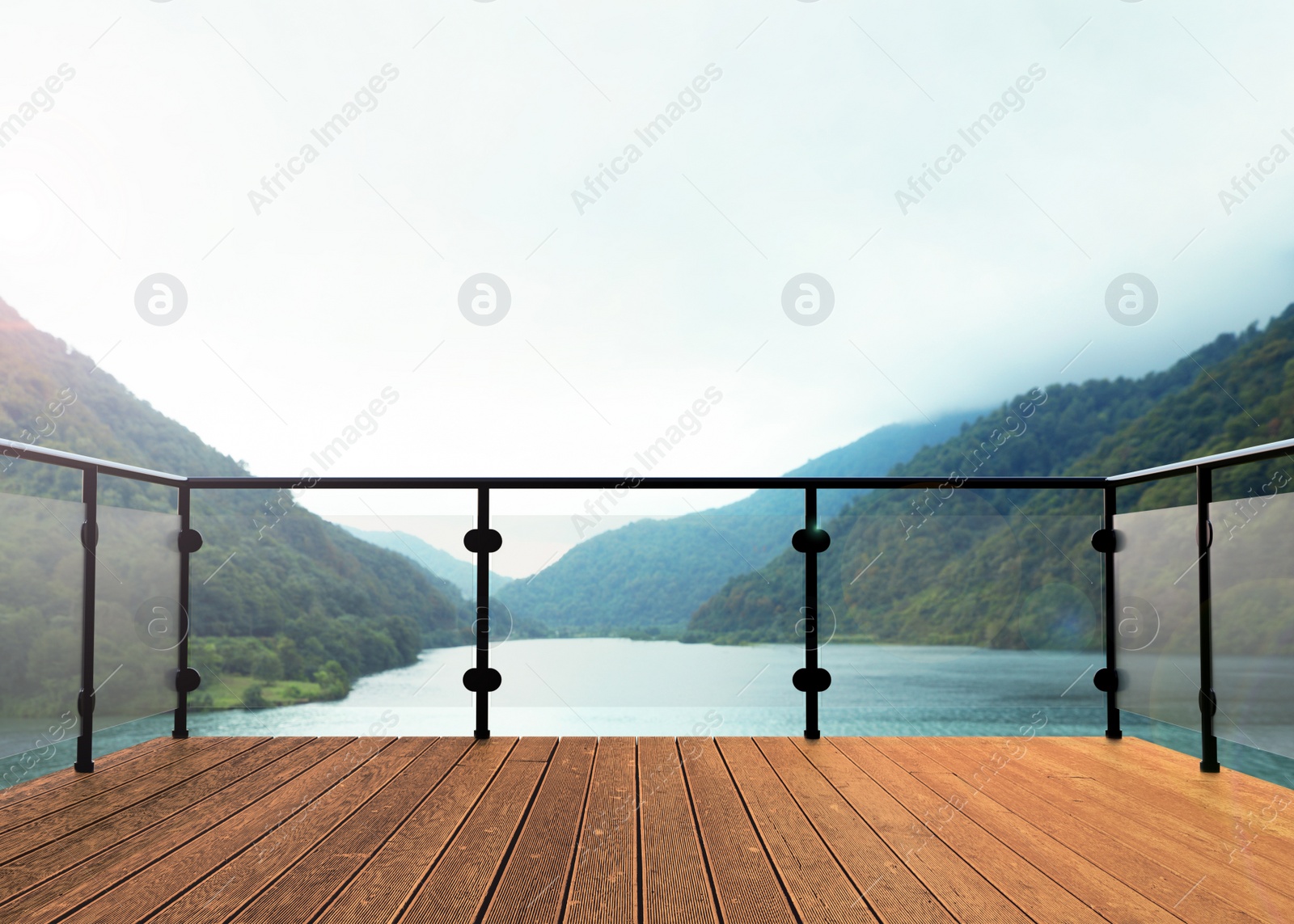 Image of Outdoor wooden terrace revealing picturesque view on lake between mountains