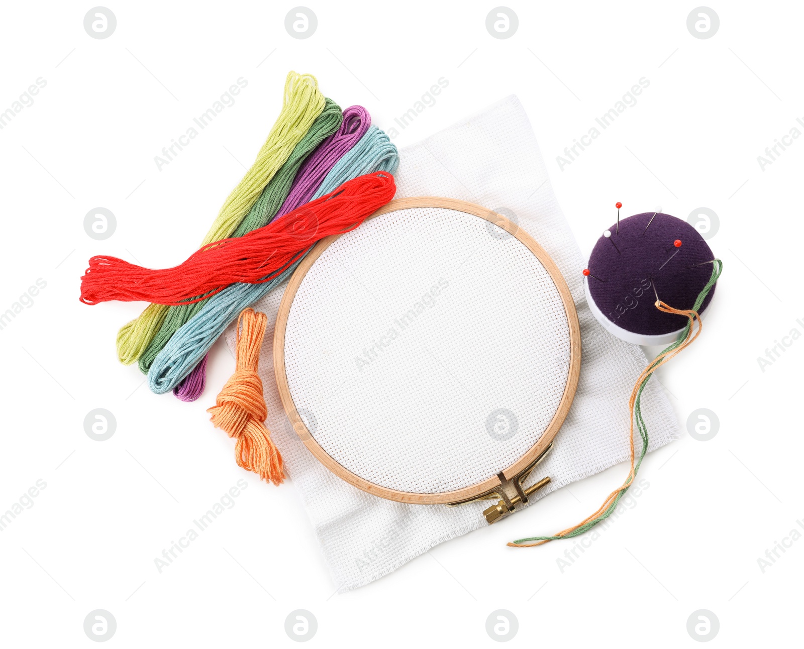 Photo of Set of embroidery equipment on white background, top view