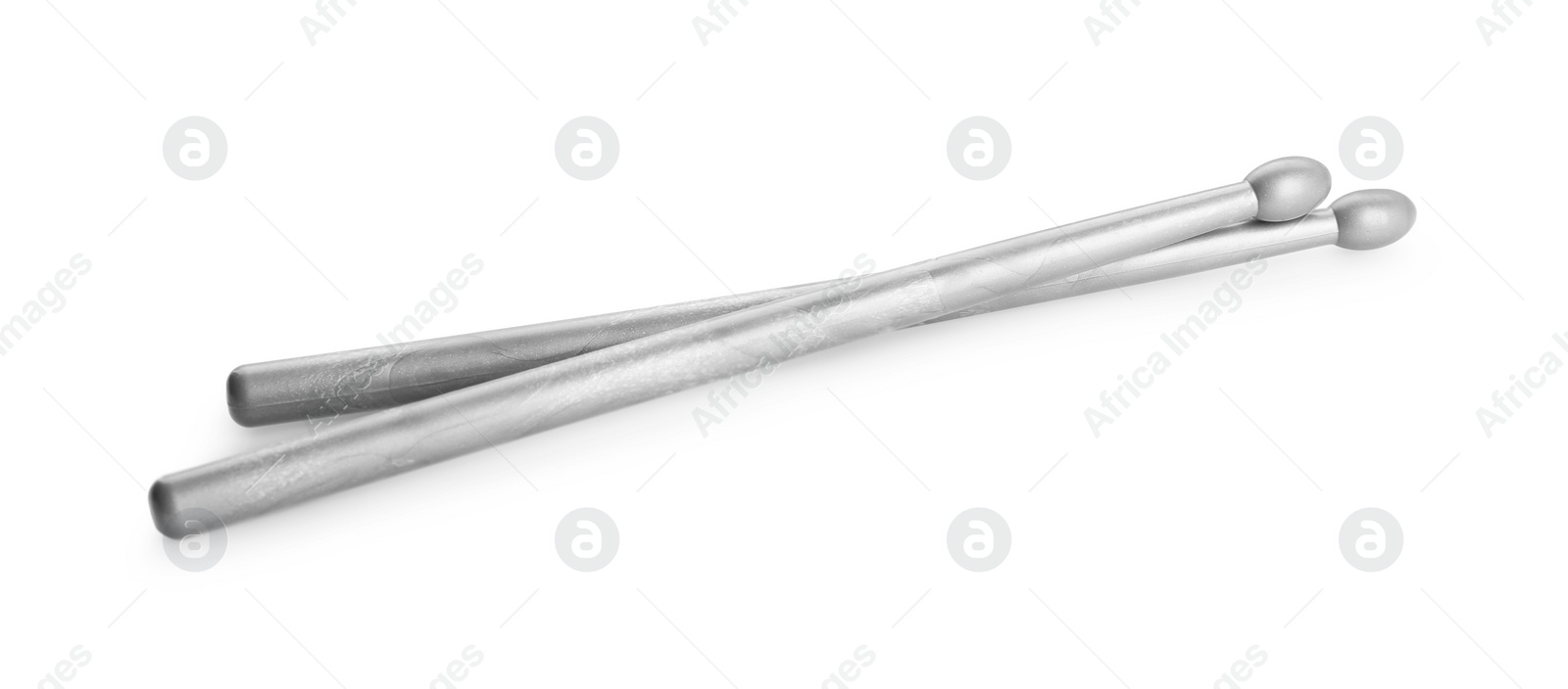 Photo of Two grey drum sticks isolated on white