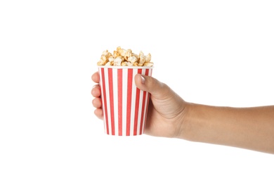 Photo of Woman holding cup with delicious popcorn on white background, closeup